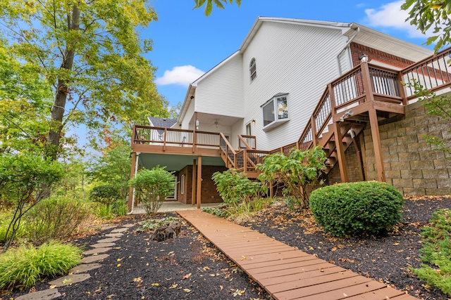 rear view of house with a deck