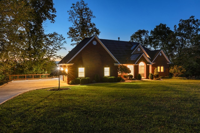 view of front of property with a lawn