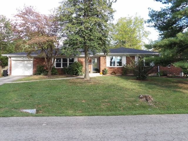 ranch-style home featuring a front lawn and a garage