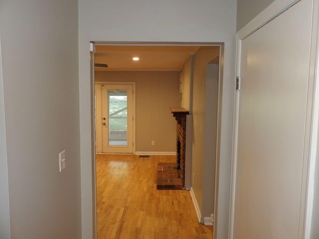 corridor featuring light hardwood / wood-style flooring