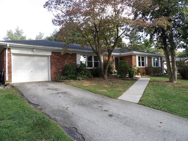 single story home featuring a garage and a front lawn