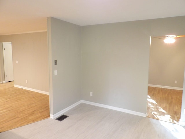 spare room featuring light hardwood / wood-style flooring