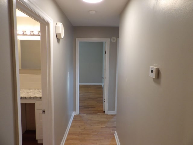 hallway featuring light hardwood / wood-style flooring