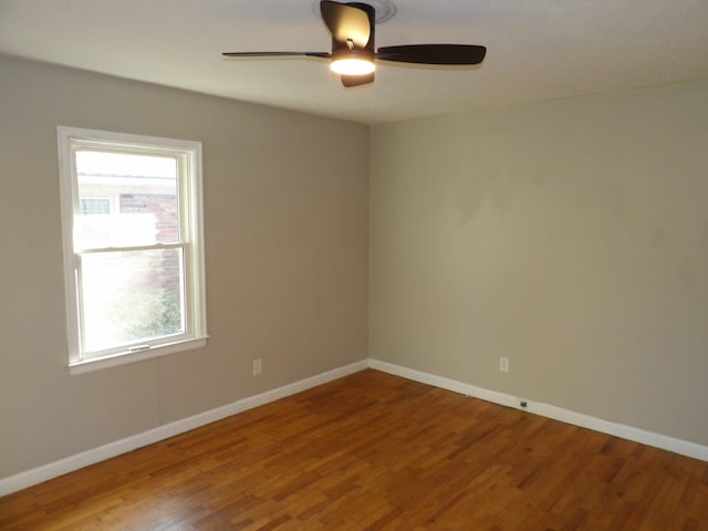 unfurnished room featuring ceiling fan and hardwood / wood-style flooring