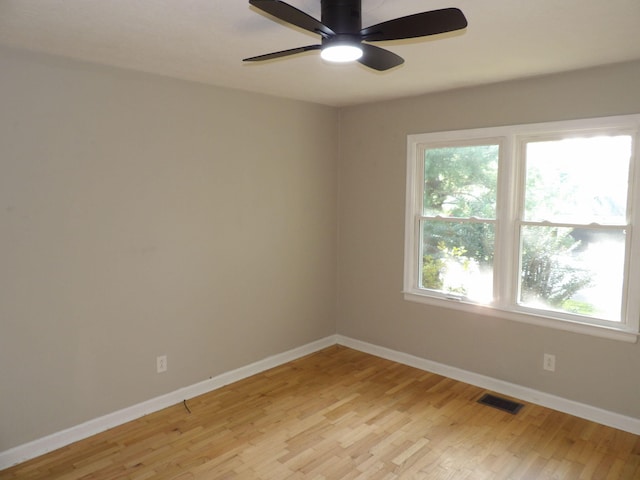 unfurnished room featuring ceiling fan and light hardwood / wood-style flooring