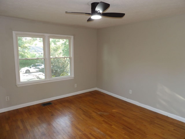 unfurnished room featuring ceiling fan and hardwood / wood-style flooring