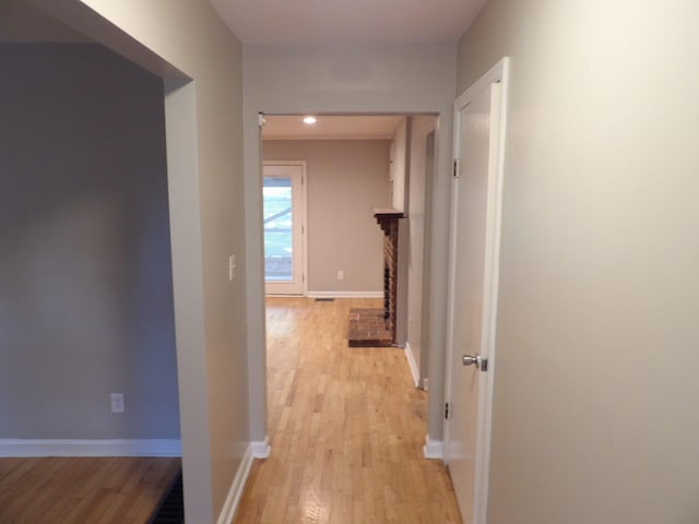 hall with light wood-type flooring