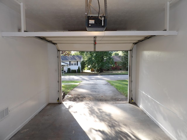 garage featuring a garage door opener