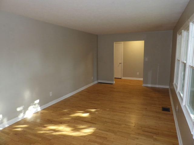 spare room with light wood-type flooring