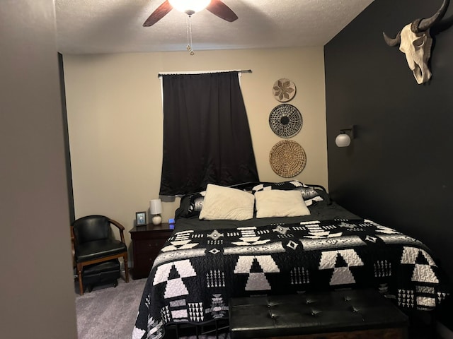 bedroom with carpet floors, a textured ceiling, and ceiling fan