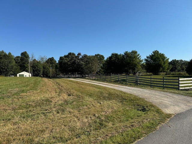 view of yard with a rural view