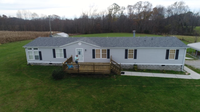 view of front of property featuring a deck and a front lawn