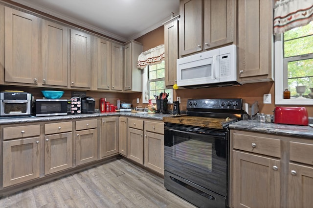 90 Damy Ln, Campton, KY 41301 - kitchen with black range with electric cooktop, white microwave, stainless steel microwave, light wood-style floors, and ornamental molding