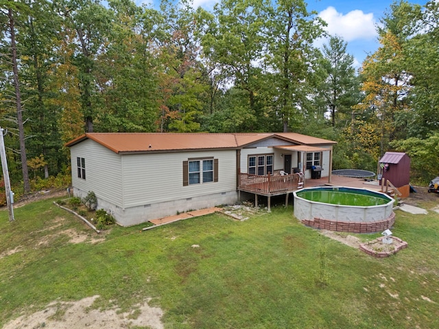 90 Damy Ln, Campton, KY 41301 - rear view of house featuring crawl space, an outdoor pool, a wooden deck, a yard, and metal roof