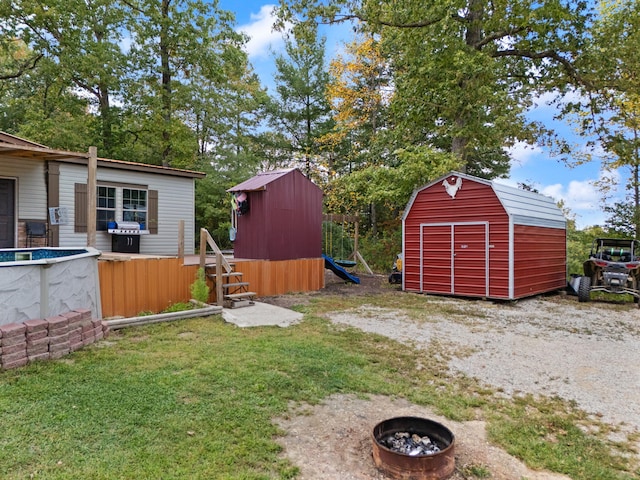 90 Damy Ln, Campton, KY 41301 - view of grassy yard with an outdoor fire pit