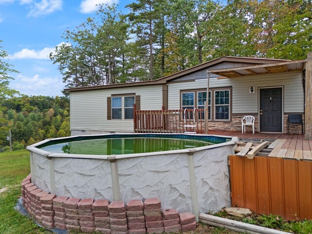 90 Damy Ln, Campton, KY 41301 - back of house featuring an outdoor pool and a deck