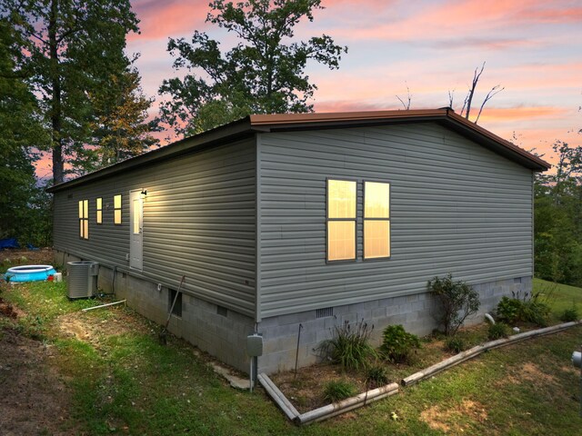 90 Damy Ln, Campton, KY 41301 - property exterior at dusk featuring crawl space and cooling unit
