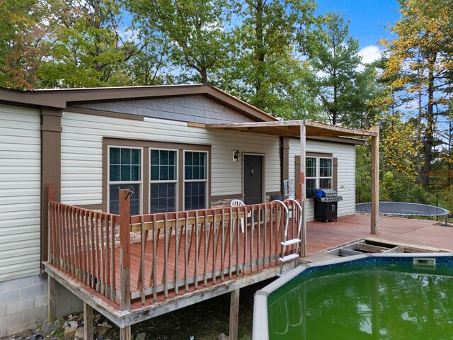 90 Damy Ln, Campton, KY 41301 - back of house with a wooden deck and an outdoor pool