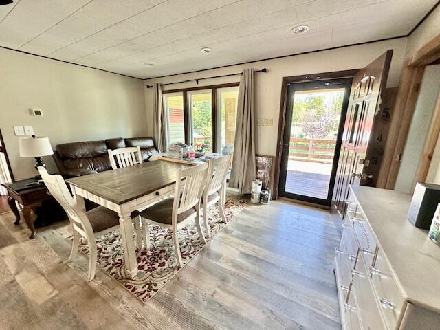 dining space featuring light hardwood / wood-style flooring