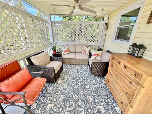 view of patio / terrace with ceiling fan and an outdoor living space