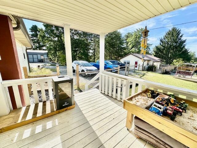 wooden deck featuring a storage shed