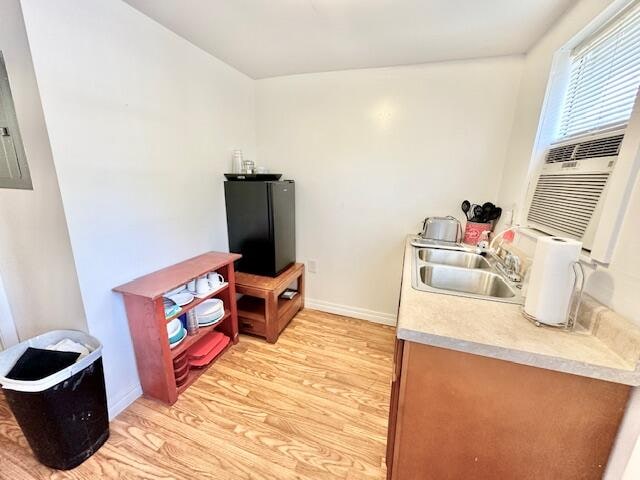 interior space with light wood-type flooring and sink