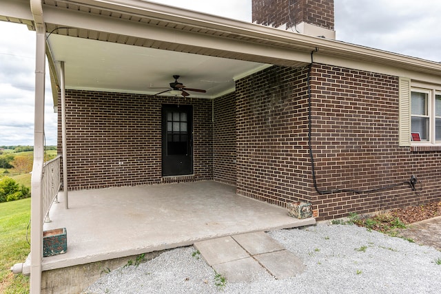 doorway to property featuring ceiling fan and a patio