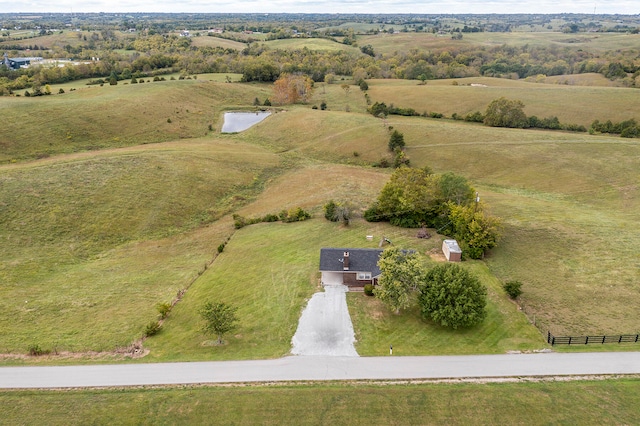 birds eye view of property with a rural view