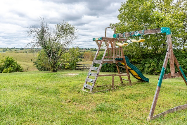 view of play area with a yard and a rural view