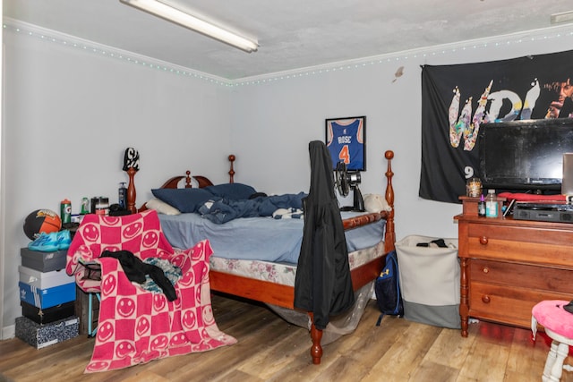 bedroom with hardwood / wood-style floors