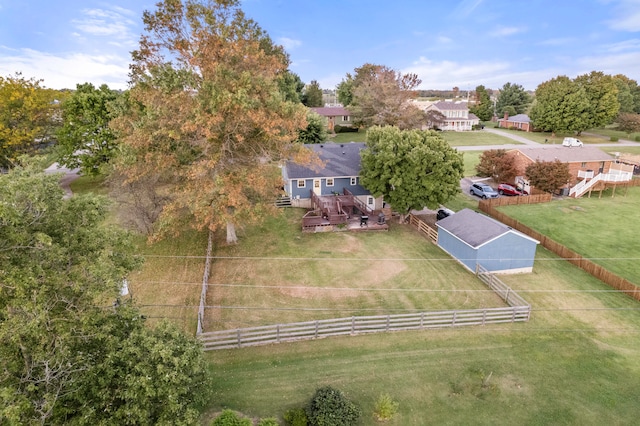 birds eye view of property with a rural view