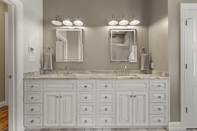 bathroom featuring vanity and hardwood / wood-style floors