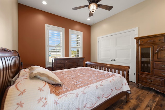 bedroom with ceiling fan and dark hardwood / wood-style floors