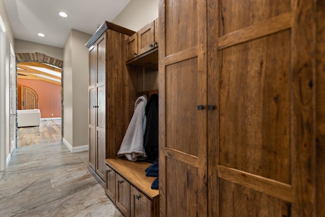 mudroom with lofted ceiling