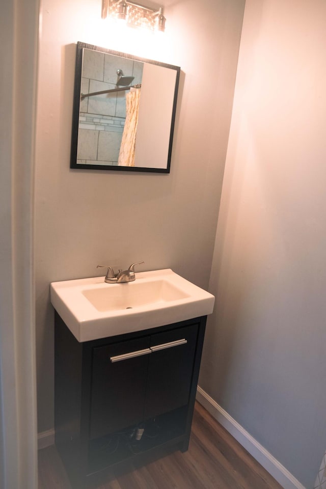 bathroom with vanity and hardwood / wood-style flooring