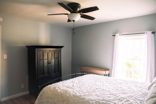 bedroom featuring dark wood-type flooring and ceiling fan