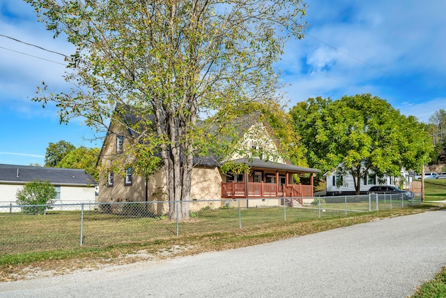 view of front of house featuring a front lawn and covered porch