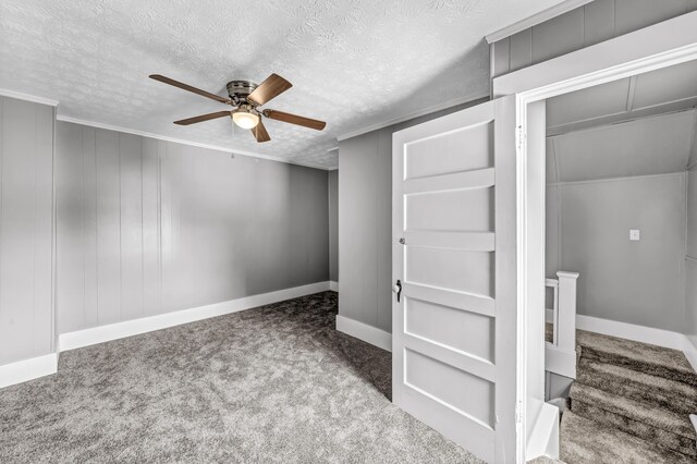 interior space with a textured ceiling and ceiling fan