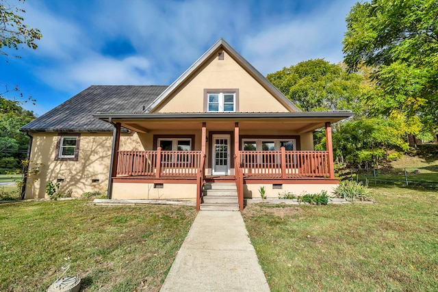 view of front of property with a porch and a front lawn