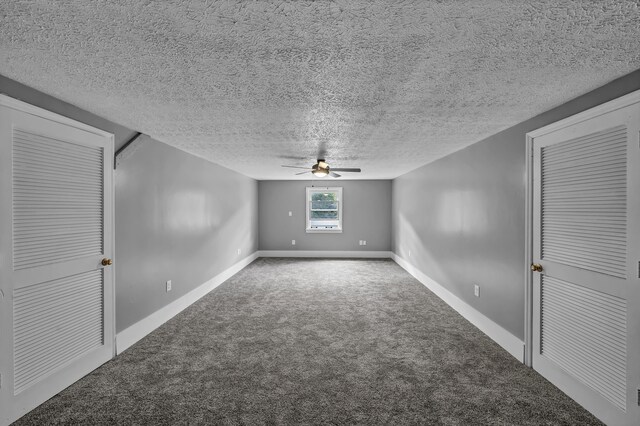 additional living space with ceiling fan, carpet flooring, and a textured ceiling