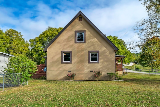 view of home's exterior with a yard