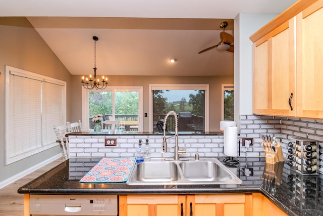 kitchen with sink, light brown cabinetry, and white dishwasher