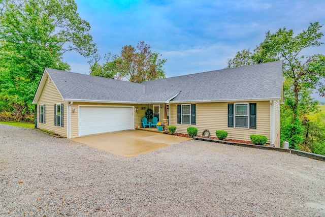 ranch-style house featuring a garage