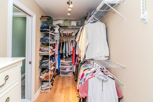 walk in closet featuring light wood-type flooring