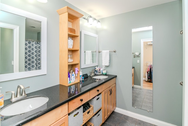 bathroom featuring tile patterned flooring and vanity