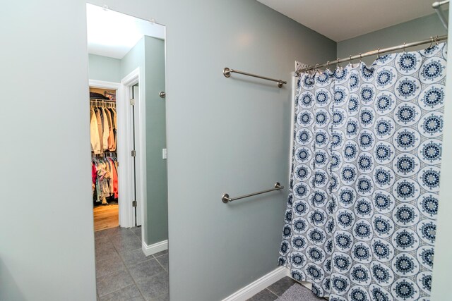 bathroom with tile patterned floors and toilet