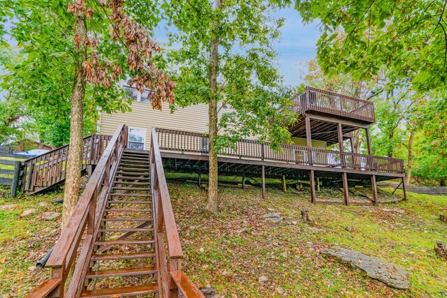 back of house featuring a deck