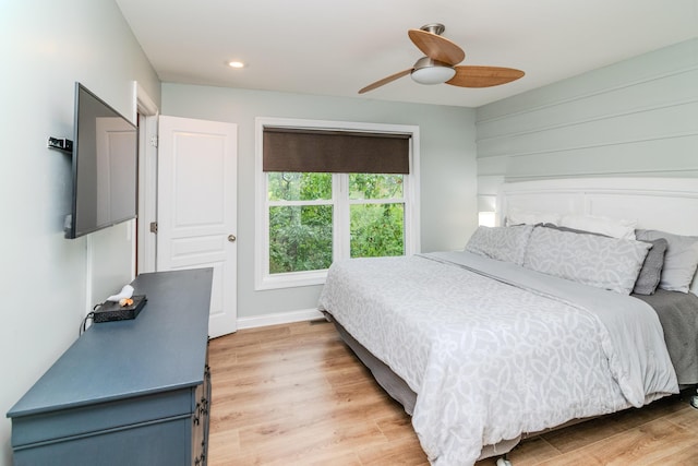 bedroom featuring hardwood / wood-style floors and ceiling fan