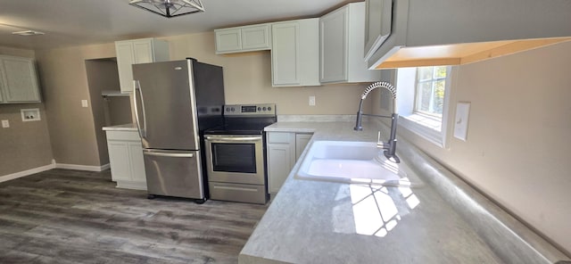 1835 Echo Point Rd, Bronston, KY 42518 - kitchen with appliances with stainless steel finishes, a sink, dark wood-type flooring, white cabinetry, and light countertops