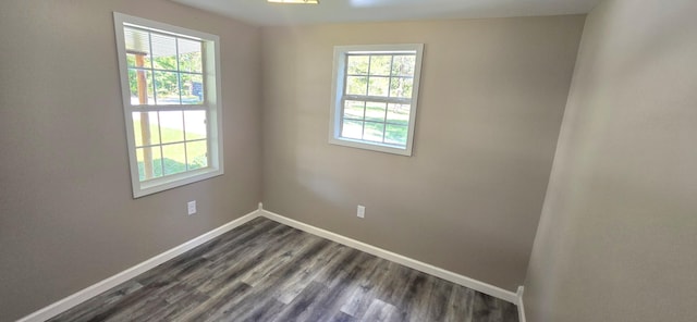 1835 Echo Point Rd, Bronston, KY 42518 - unfurnished room featuring plenty of natural light, baseboards, and dark wood-type flooring